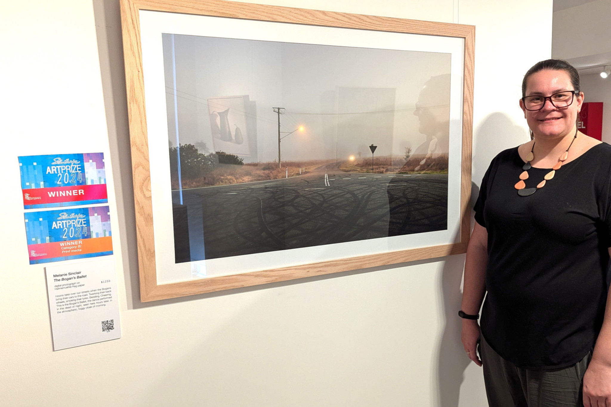 Mel Sinclair, with her winning "Bogan's Ballet" at the Stanthorpe Regional Art Gallery.