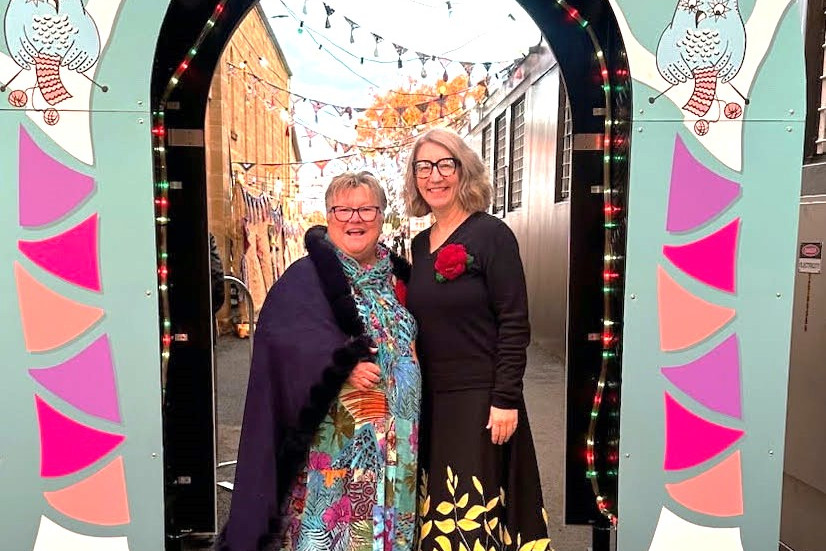 JJJ President Pam Burley with Mayor Melissa Hamilton (right) who said "the crocheted roses on the boots and shoulder rosette gave the nod to our beautiful Rose City".