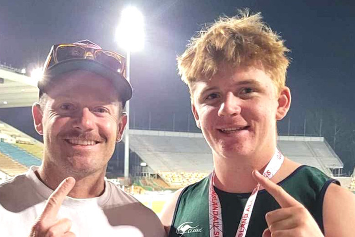 Coach Nathan Rogers and Harry Hume after a gold in shot put. Photo: Bec Rogers