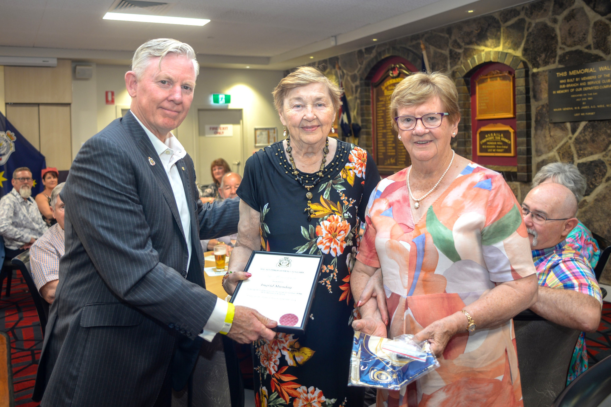 Major General Stephen Day DSC AM presents Ingrid Munday with her RSL Women’s Auxiliary Life Membership, supported by Women’s Auxiliary President, Veronica Ryan. Photo Sandra McEwan.