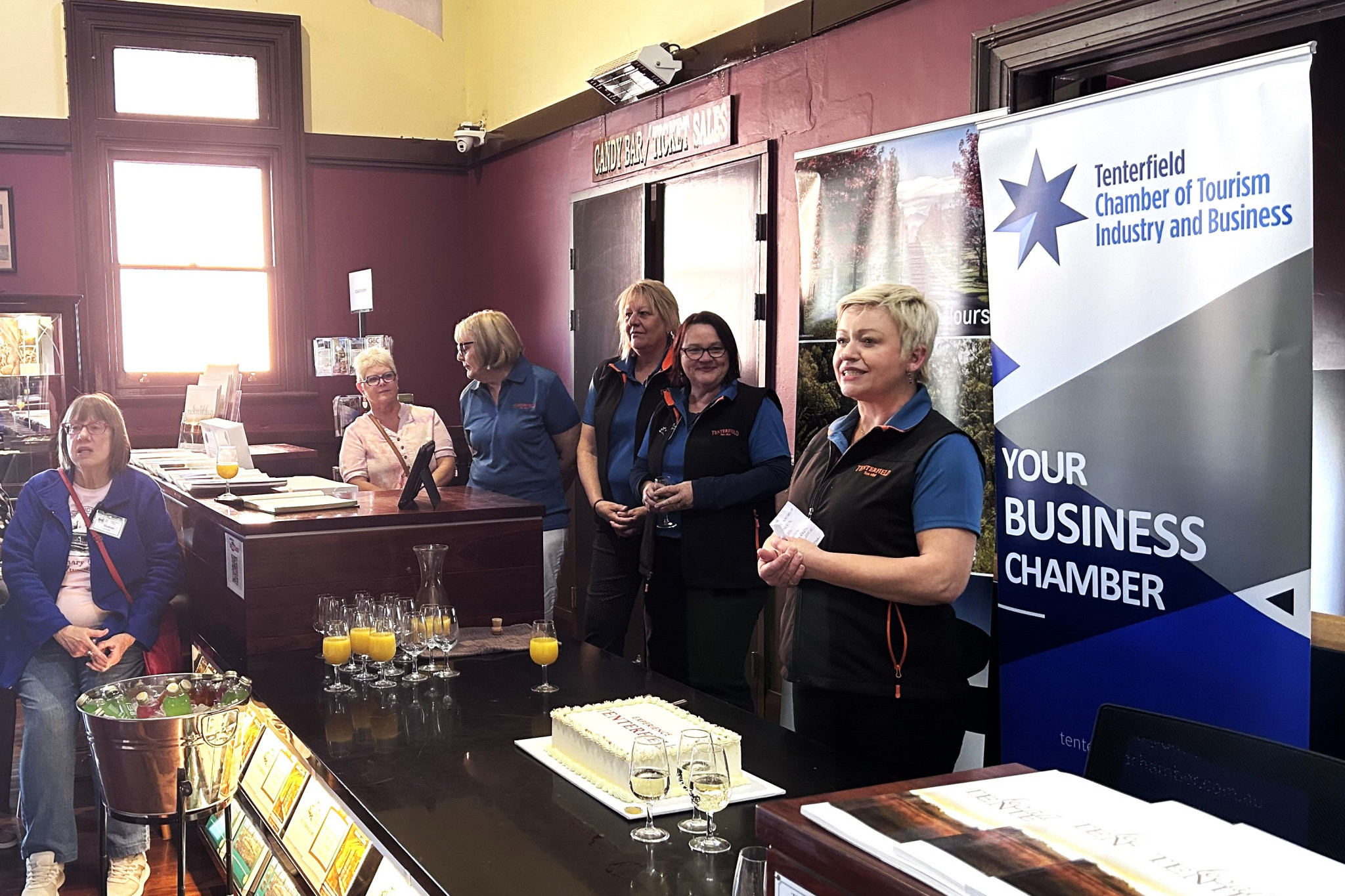 Volunteers gather to celebrate the opening of the new tourist information centre. Photo: Sera Wright